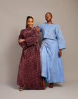 Women’s pleated two-piece set with wide sleeves and maxi skirt.