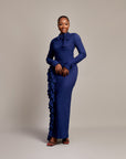 Amira Dress in navy blue with high neckline and bow tie detail.