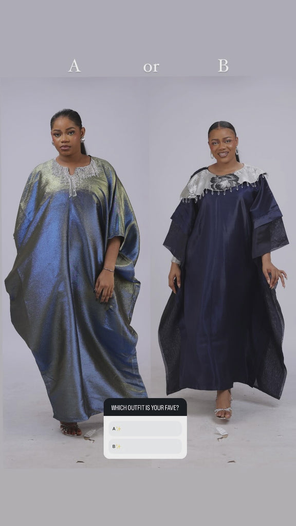 Woman wearing a shiny metallic blue-green cupped chain dress with loose sleeves and embellished neckline.
